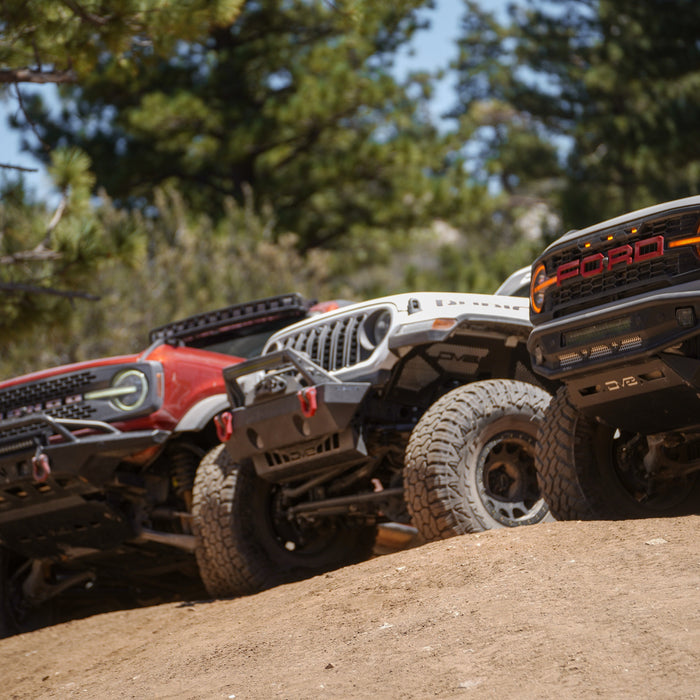 DV8's off-road bumpers mounted to a Bronco, Jeep, and Raptor.